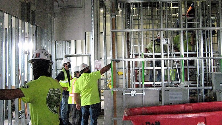 construction crew working inside the engineering building