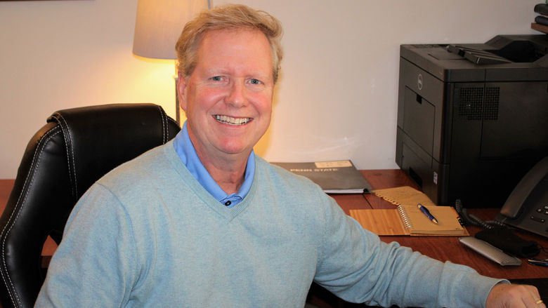 Jim Hart seated at his desk in his office