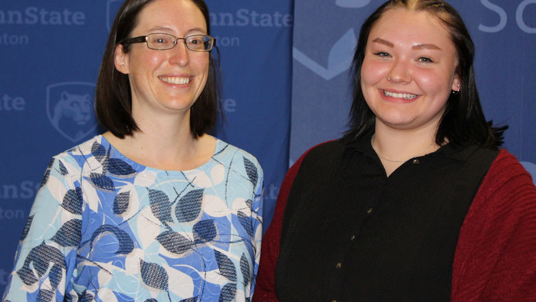 Kayla Kozlowski receives her award from Meg Van Etten