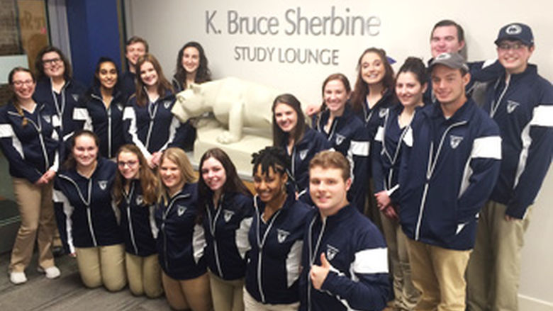 Lion Ambassadors group poses with Nittany Lion statue