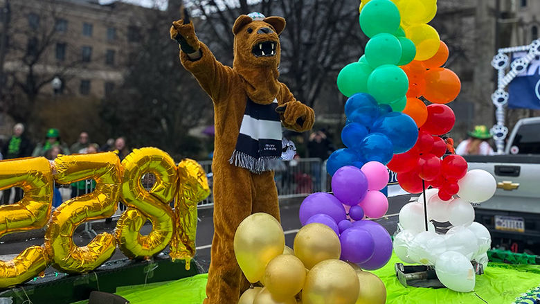 mascot on balloon float in parade