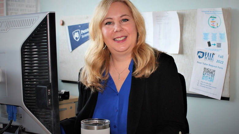 Megan Cruciani seated at her computer
