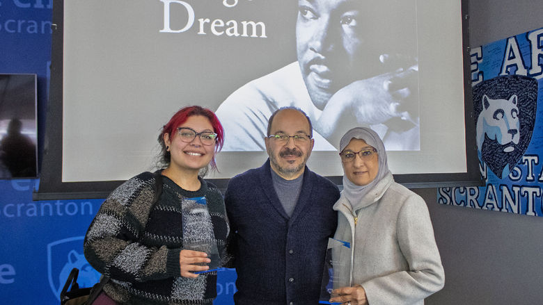 Diversity award winners pose for photo holding awards