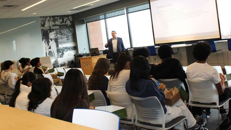 Attorney Joseph Litvak talks to students in the Sherbine Lounge