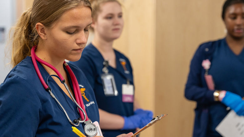 Nursing students in patient simulator lab