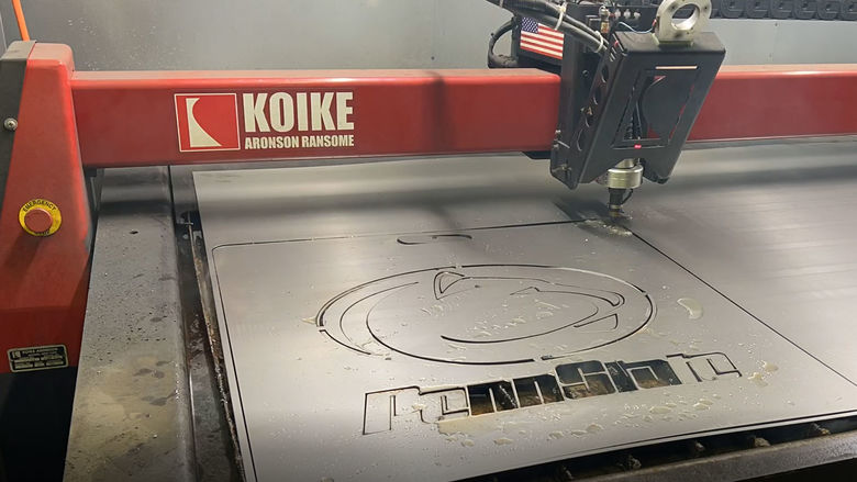 penn state logo being cut into metal with a plasma cutter