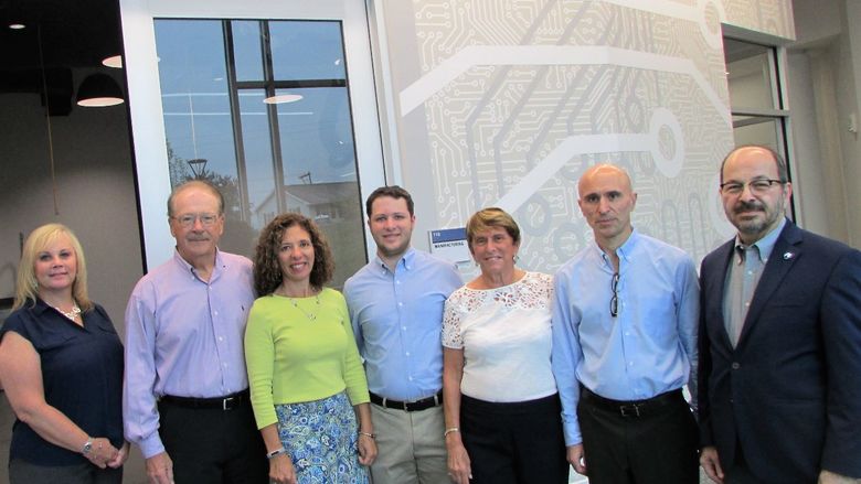 Scandale family in front of named engineering lab