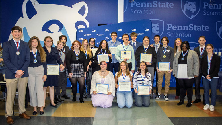 winners in scranton's research fair pose with their certificates and medals