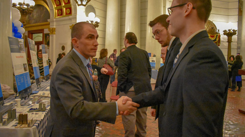 Shemus shaking hands