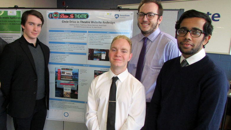 Winners in the technology category pose by their poster