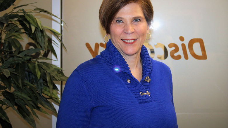 Terri Caputo standing in visitors area of admissions office