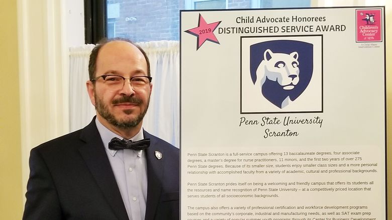 Dr. Wafa with Childrens Advocacy Center award