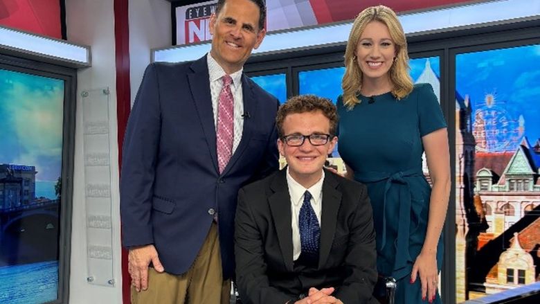 Matt Howard, center, poses on the news set with WBRE anchors Tom Williams and Kelly Byrne.