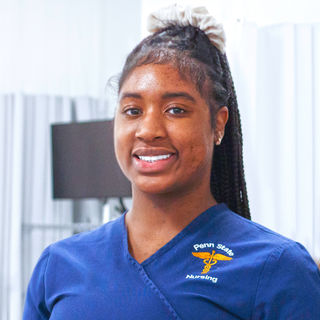 a smiling student in a lab for nurses