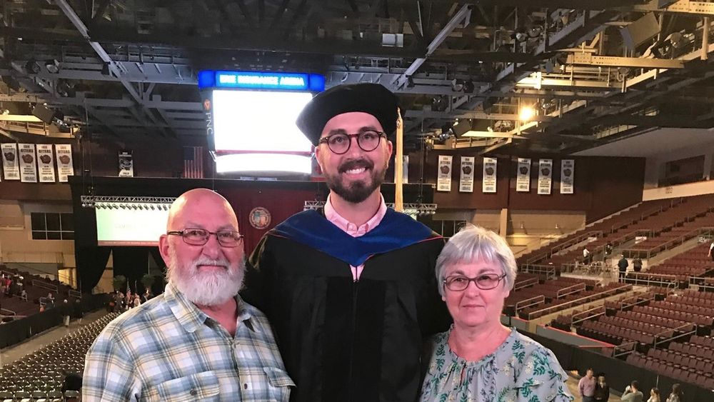 Brad Kovaleski with parents at Ph.D. graduation ceremony