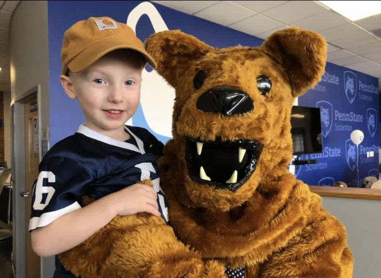 little boy with Nittany Lion at the Breakfast with the Nittany Lion
