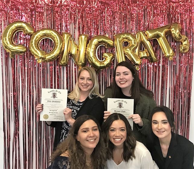 New and recently inducted members of Lambda Pi Eta pose for a group photo