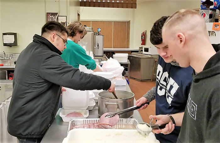 IST members serve food for One Hot Meal program