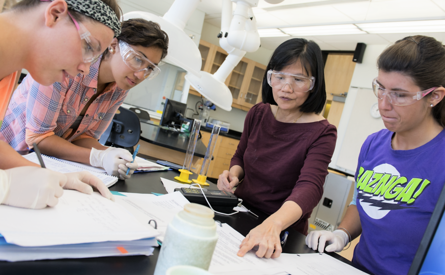 Dr. Phuong Truc-Pham working with students in the campus' chemistry lab