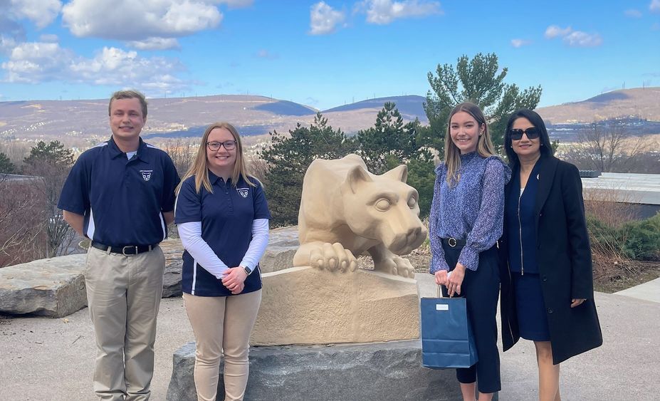 students pose with president-elect bendapudi at scranton lion shrine