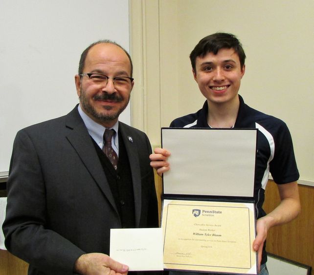 Blaum receiving award from Chancellor Marwan Wafa