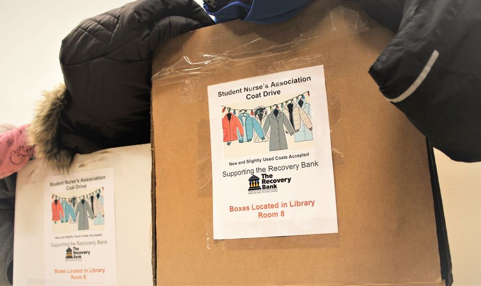 two boxes filled with coats have been collected for the SNA's coat drive
