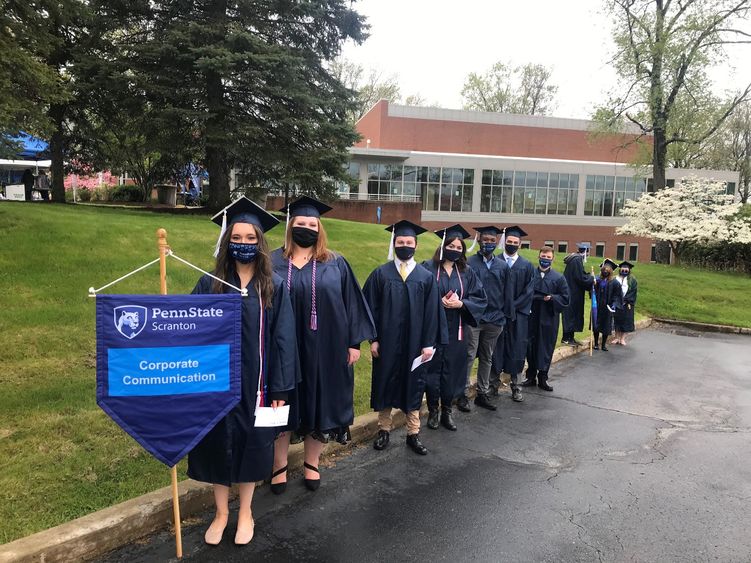 Graduating Corporate Communication students line up before commencement