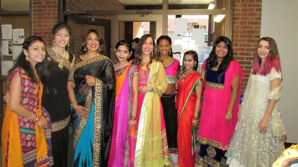 a group of female Indian students dressed in formal gowns for Diwali 2019