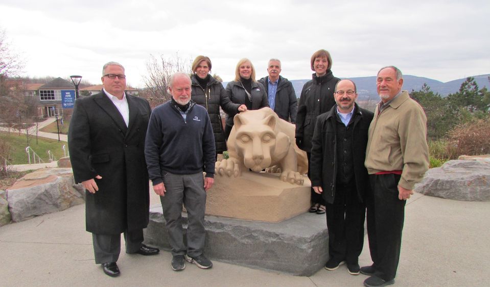 donors and penn state scranton administrators for the new grant posing for a photo at the campus lion shrine