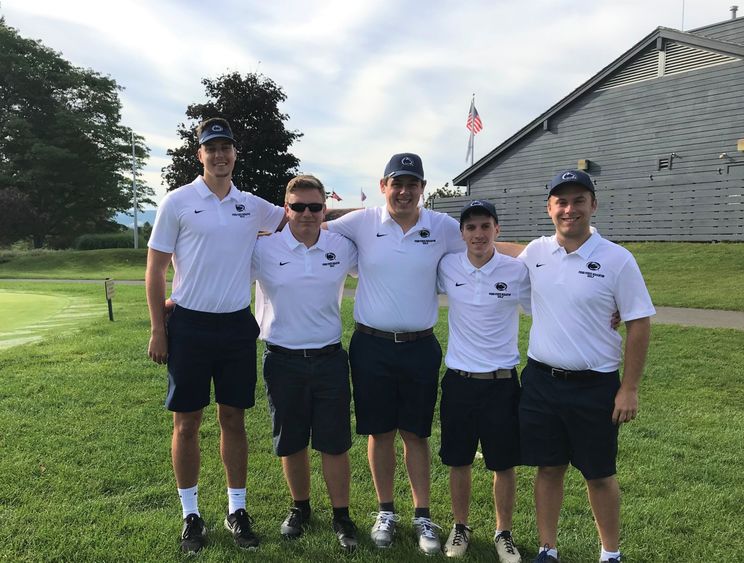 Golf team members pose for a photo