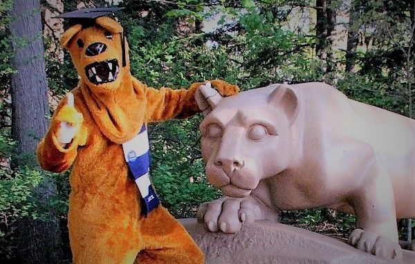 nittany lion mascot wearing graduation cap posing for a photo at Nittany Lion Shrine