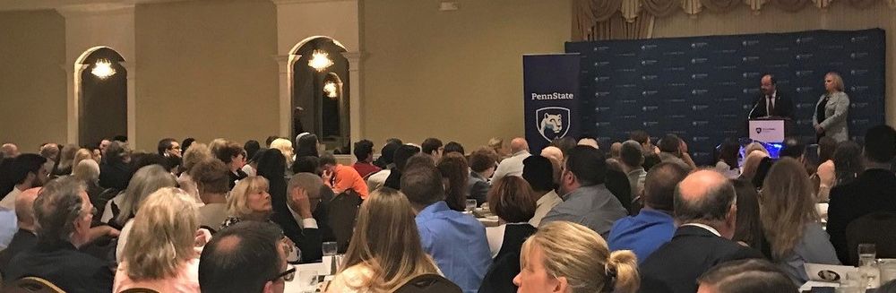 The scholarship reception attendees listening to Dr. Marwan Wafa's welcome