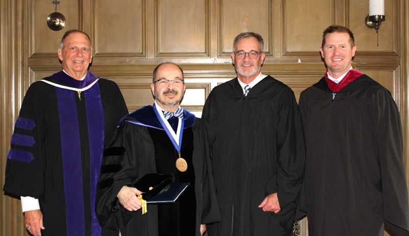 Chancellor wafa poses for a group photo at this year's commencement ceremony