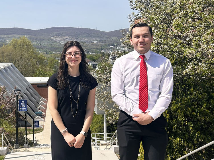 Zamarra and James pose outside for photo at Penn State Scranton, with mountains in the background
